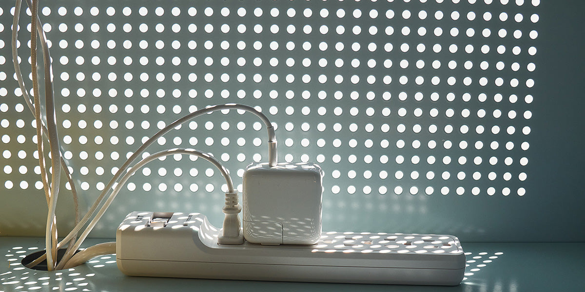 Active Duty A/V credenza back detail with cables and plug extension