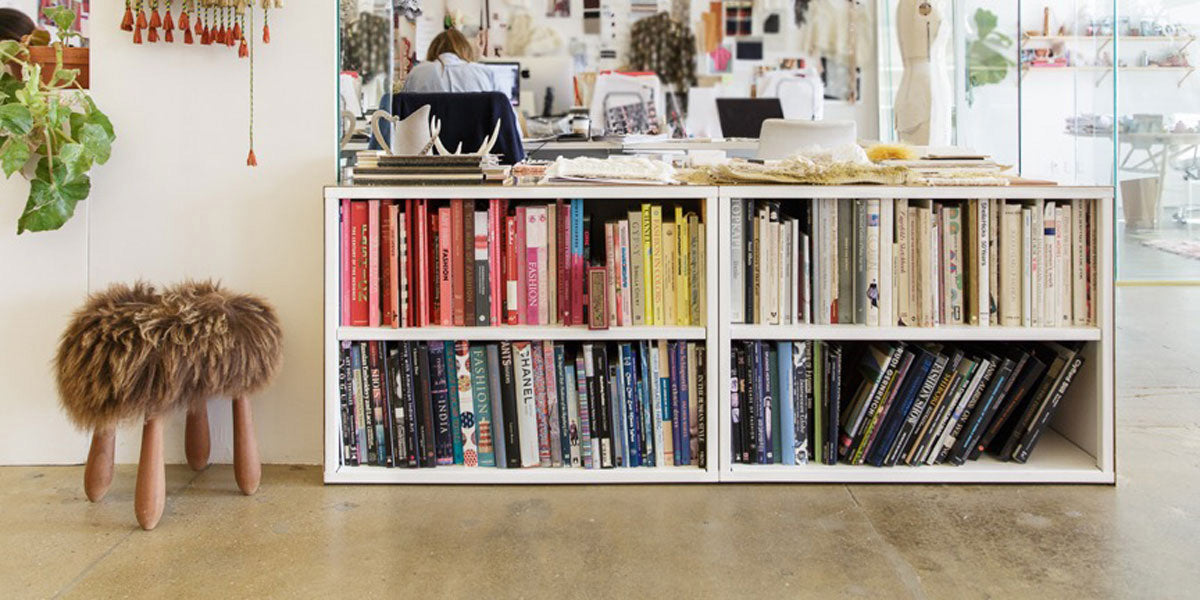 Heartwork Building Block bookcases loaded with colourful books in office setting