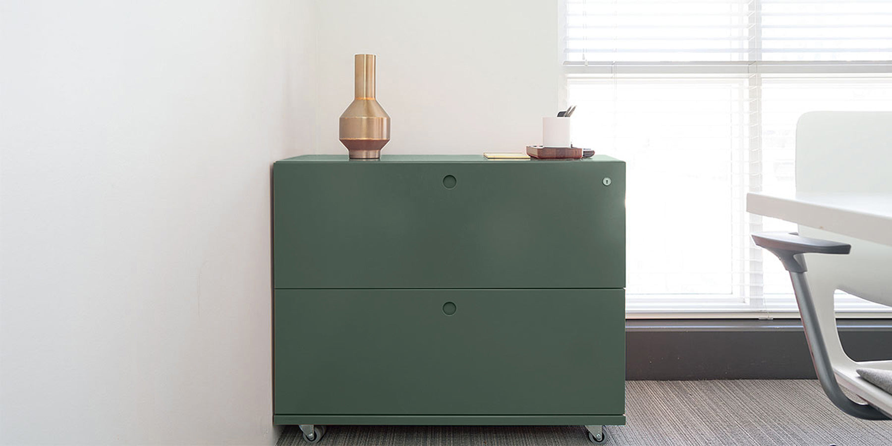 Heartwork Building Block lateral file with two drawers in green in office setting