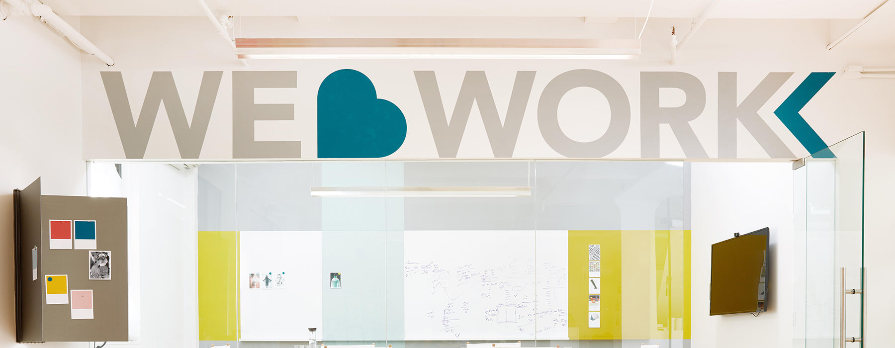 Heartwork showroom interior showing "We Love Work" quote