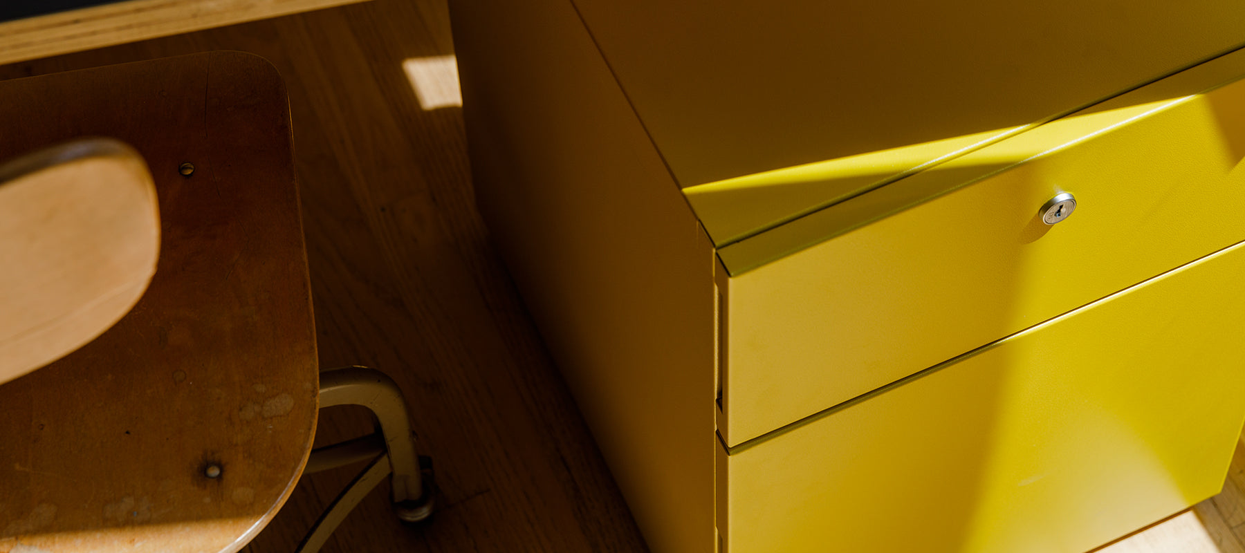 Heartwork Building Block Pedestal in warm yellow under a desk