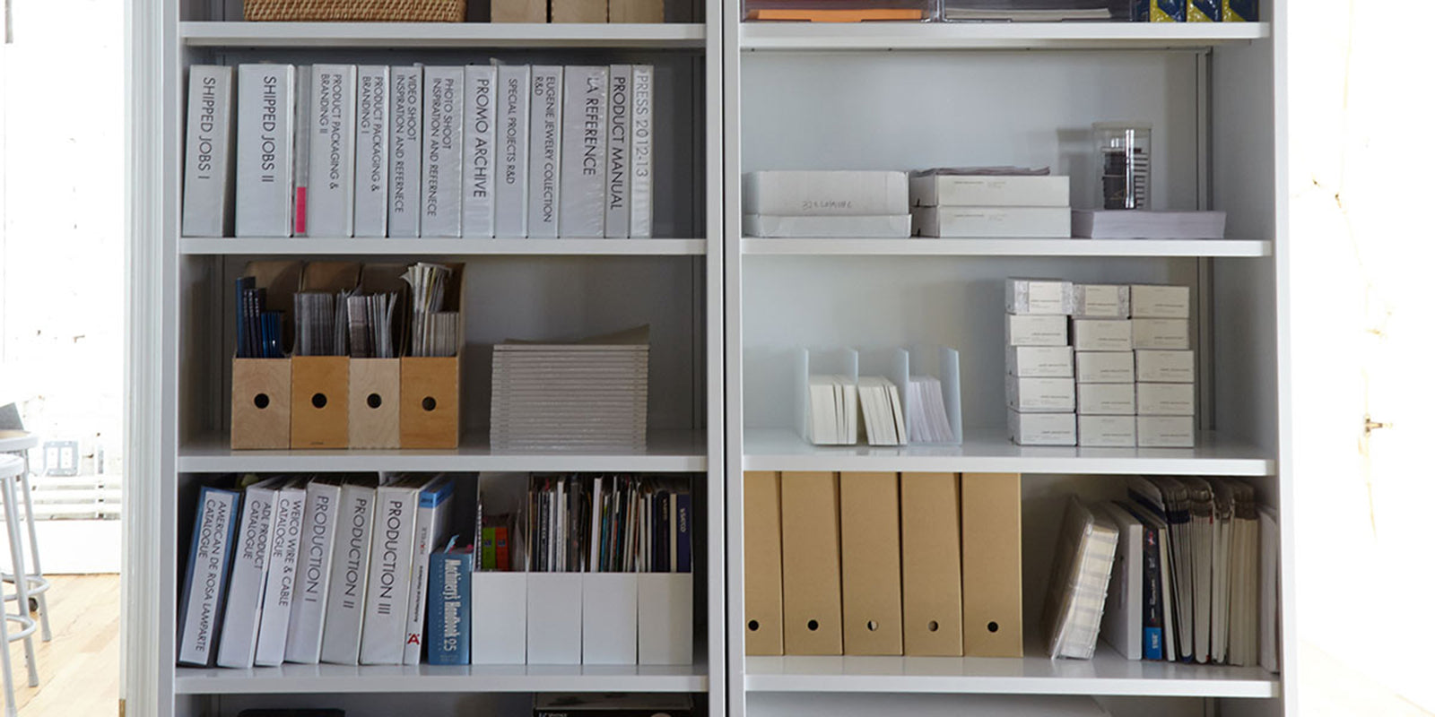 Heartwork Active Duty Bookcase with closed back in white with books and file holders