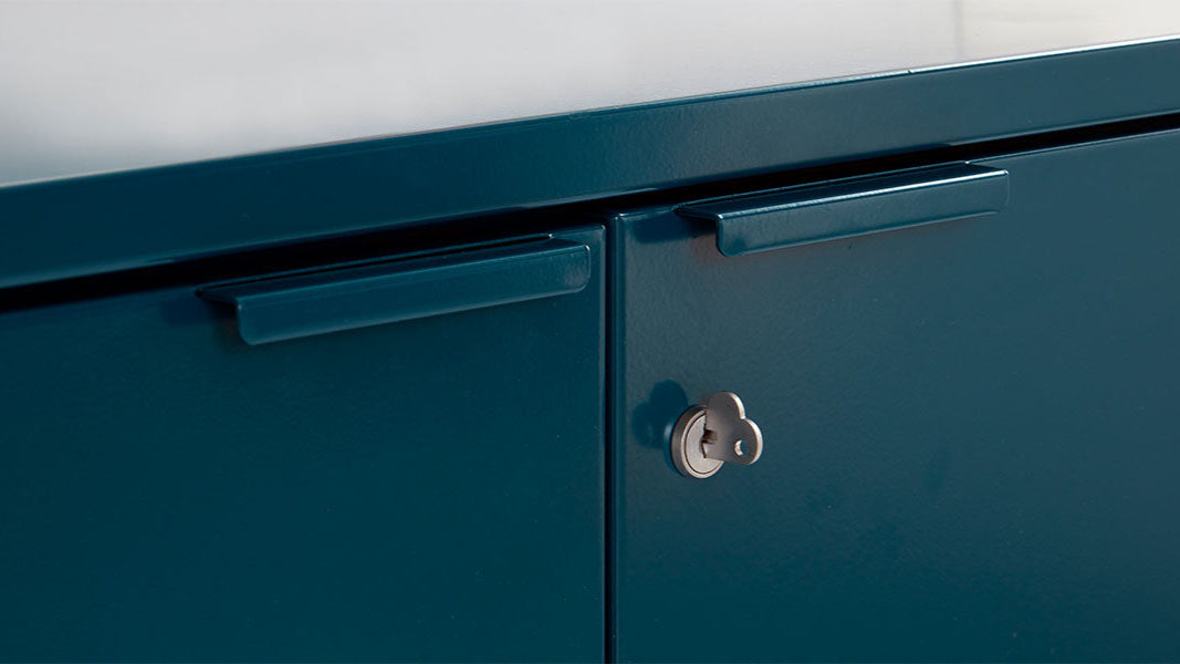 Detail of Heartwork Active Duty storage credenza showing handle and heart-shaped key