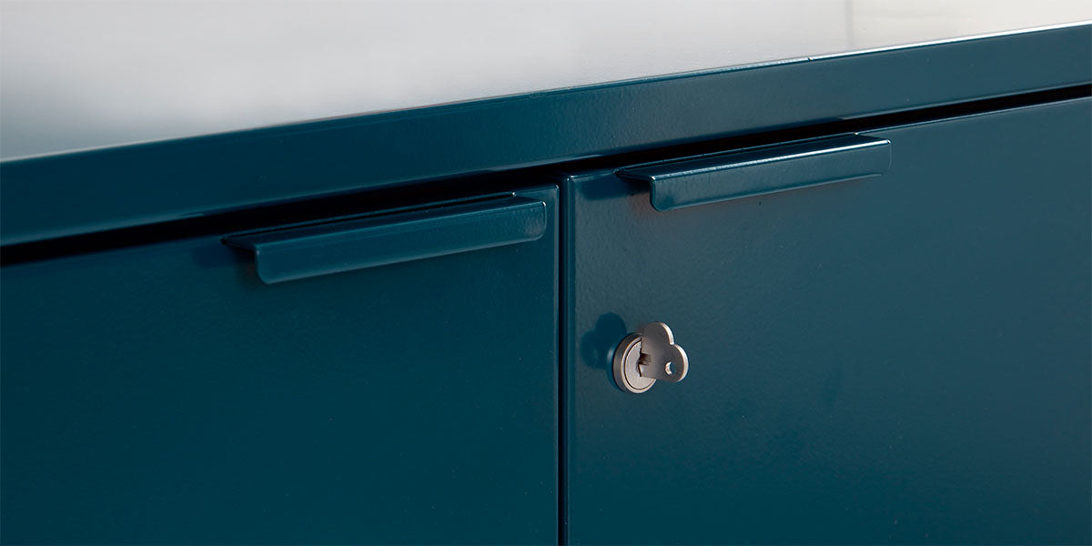 Detail of Heartwork Active Duty storage credenza showing handle and heart-shaped key