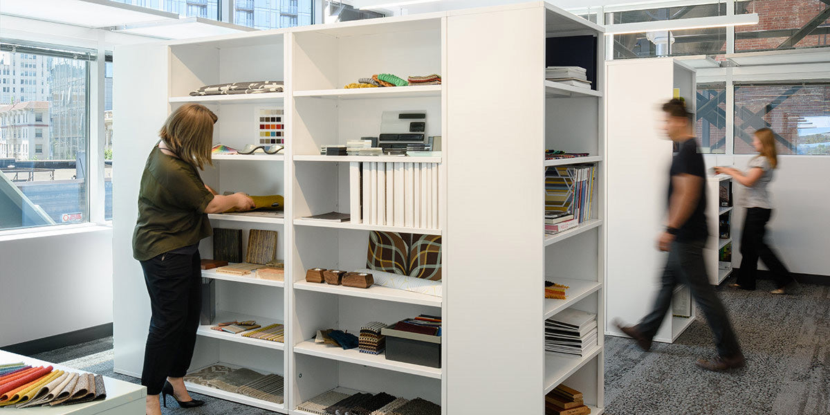 Heartwork Building Block bookcases in white used to separate spaces in office setting 