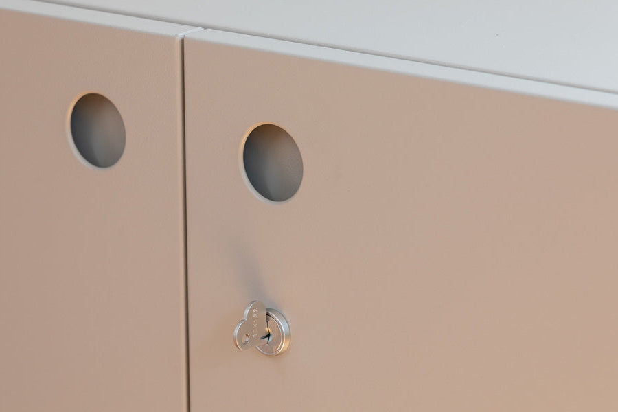 Detail of Heartwork Building Block cabinet showing porthole handles and a heart-shaped key