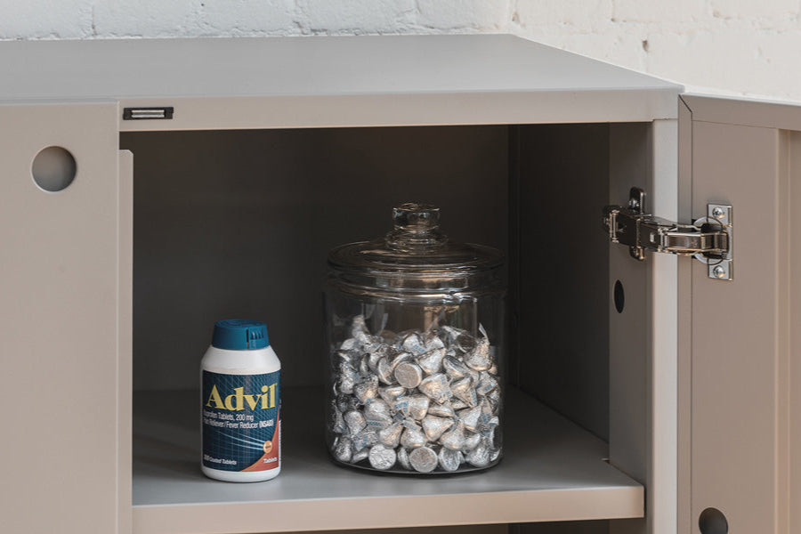 Building Block cabinet with open door showing how items like medications and sweets could be safely stored