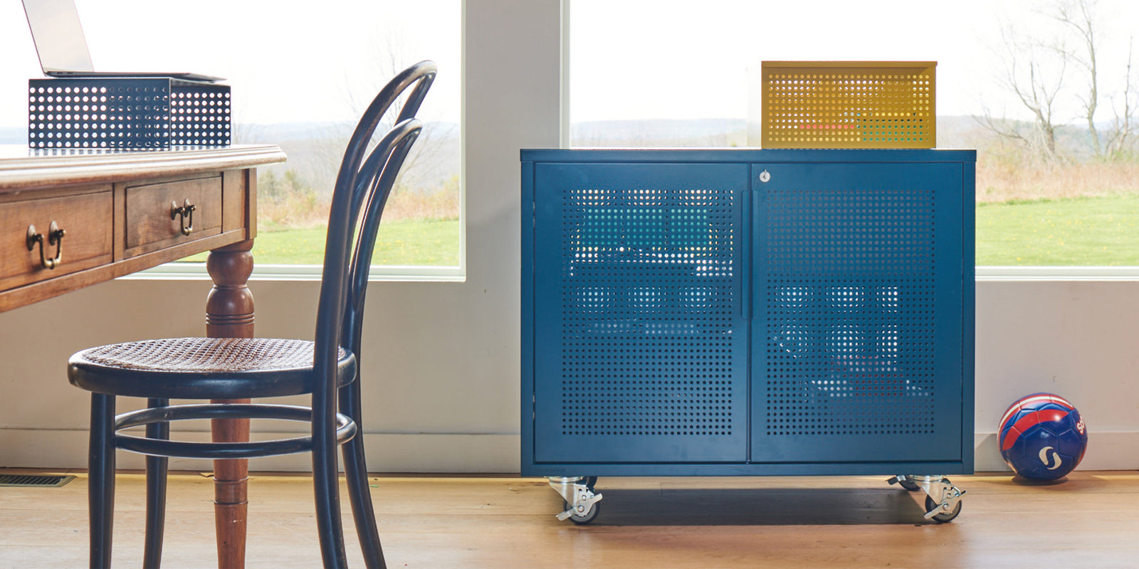 Heartwork Active Duty Assistant in blue with Perforated Basket in yellow on top in home setting