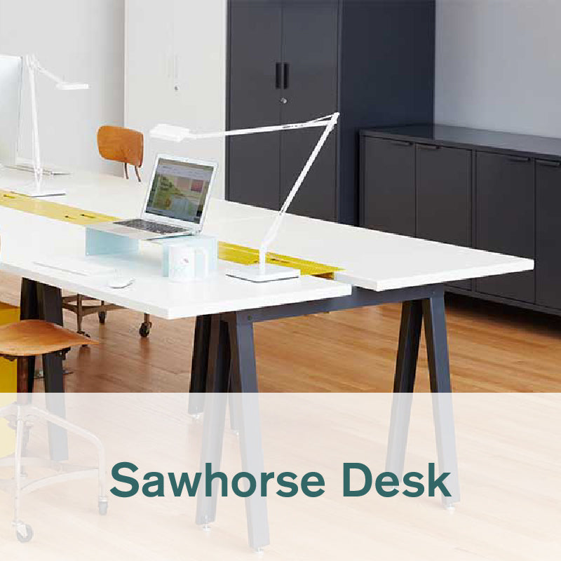 Heartwork Sawhorse desk with white top and black frame in office setting